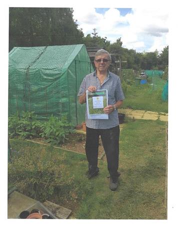 Frank proudly displaying his Certificate - Award Winners - National Allotment Week