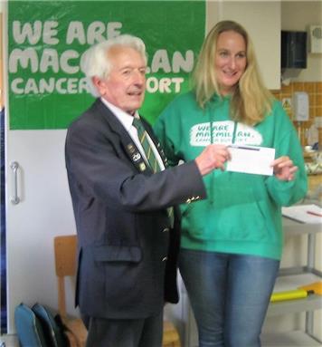 Warwick presents the £800 chequer - Macmillan Cancer Support Charity Gala
