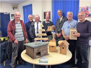 Judges Ian and Tony with SHed members and some completed project items - South West in Bloom at the RWB Shed