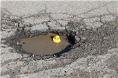 Report a Pot hole or Fly Tipping