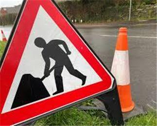 HOLE IN ROAD CUTS VILLAGE IN TWO