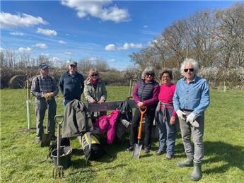 Volunteers work on Community Orchard