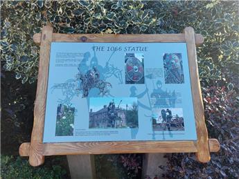 The 1066 statue plaque